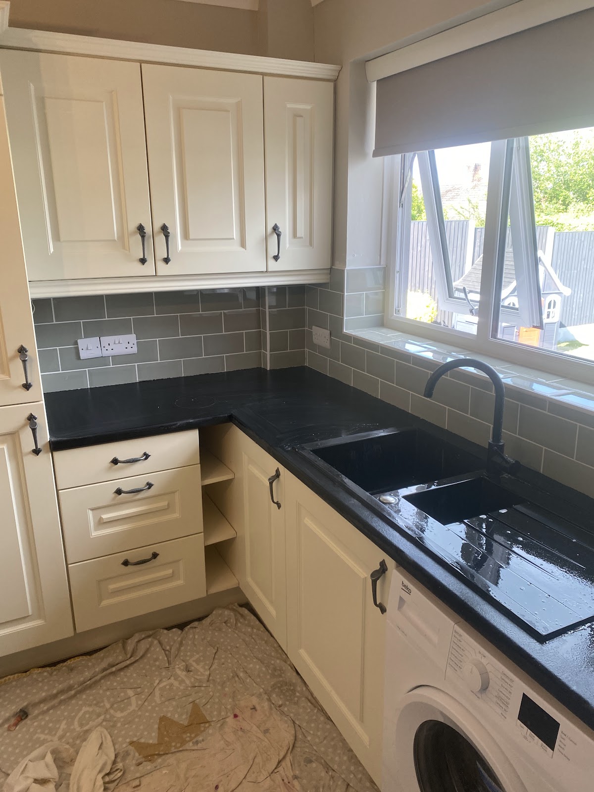 Grey metro splashback and worktop in a finished kitchen